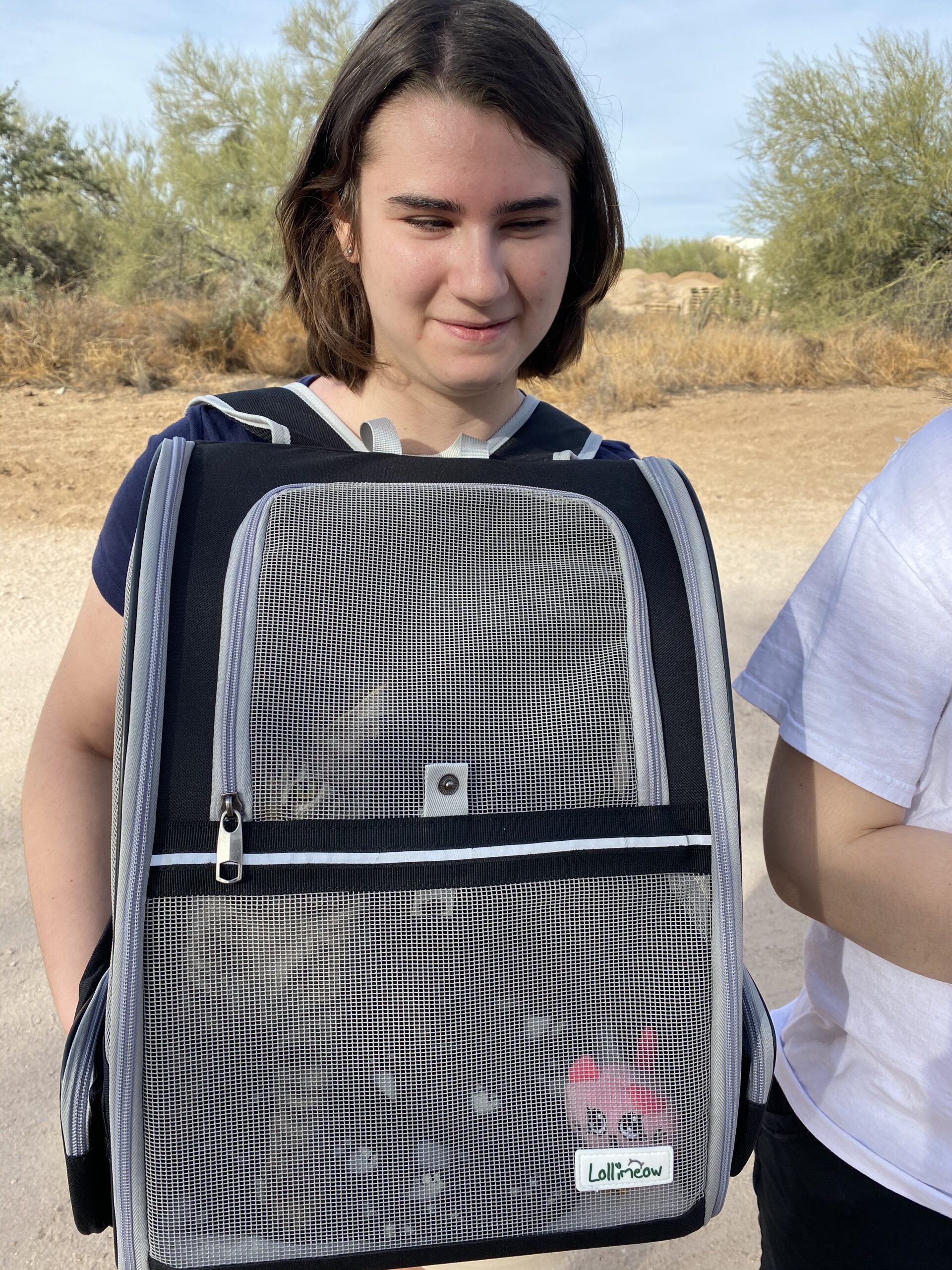 Allie with Emma in backpack